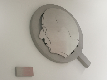 Depicting of the letter Q, commissioned by Quooker. Displayed is a side profile of Henri Peteri(1918-2007), inventor of the boiling water tap and the founding father of Quooker. Made in honour of the 25th anniversary of the company. Designed and manufactured by Marcel Timmers.