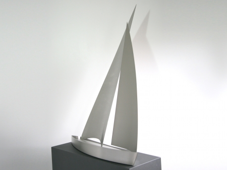 A threedimensional display of a stainless steel sailing boat, placed on metallic powder coated pedestal. 
Measurements: Object 102 x 90 x 50 cm, pedestal 118 x 90 x 32 cm. 

Series of 8 pieces. Still available. Request information how much is still available and where exhibited.