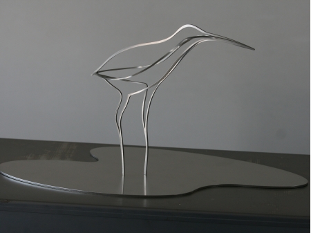 A stainless steel thread figure of a snipe bird.
Standing in a pool of water.

Measurements figure size M: 50 x 24 x 25 cm
Measurements figure size L: 60 x 33 x 25 cm

Size M Series of 8, of which 3 sold.
Size L Series of 8, of which 1 sold.


