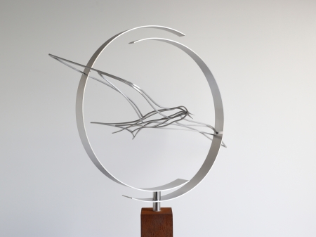 Stainless steel circle consisting of two half circles with a tern bird flying through. With a Cor ten steel pedestal.

Measurements : 70 x 40 x 160 cm.

Series of 8, of which 1 sold.
