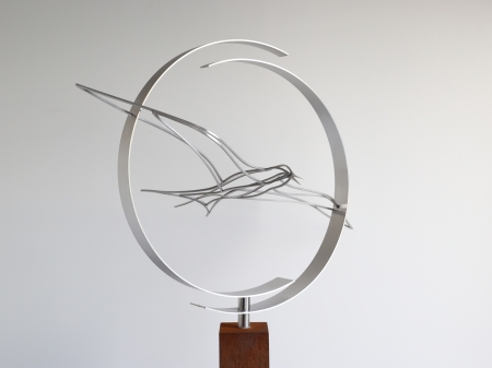 Stainless steel circle consisting of two half circles with a tern bird flying through. With a Cor ten steel pedestal.

Measurements : 70 x 40 x 160 cm.

Series of 8, of which 1 sold.